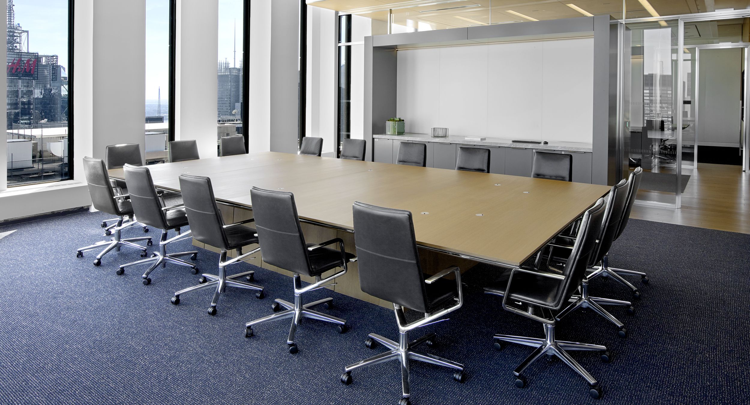 A beautiful Rift Oak and Polished Chrome MESA table with continuous base.